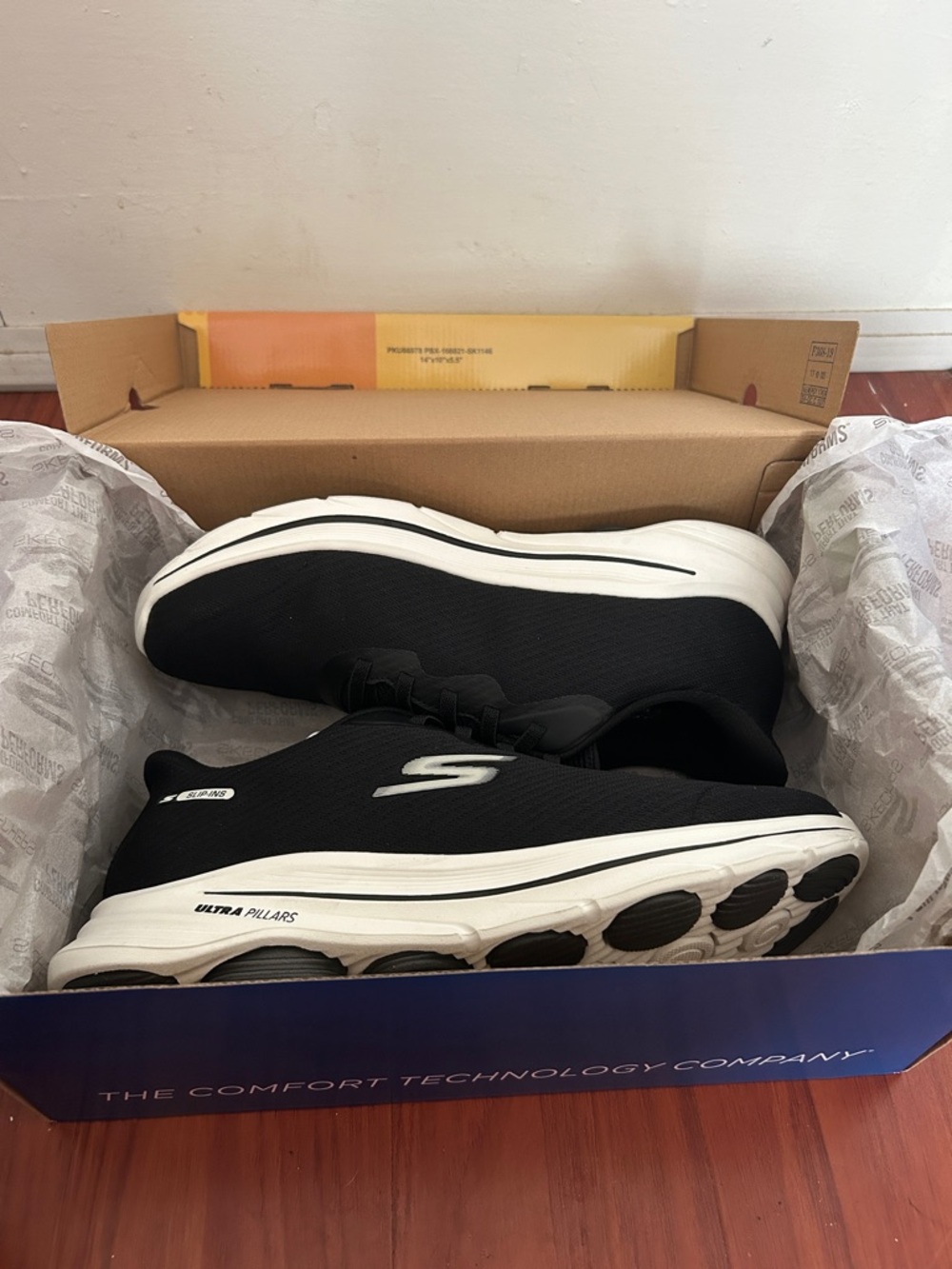 Skechers Men's Black and White Slip-On Athletic Sneakers